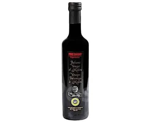 Dark glass bottle of Prezioso balsamic vinegar of Modena